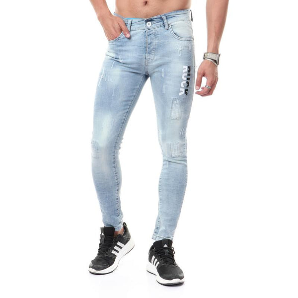 جينز ممزق مع طباعة جانبية بلون أزرق فاتح